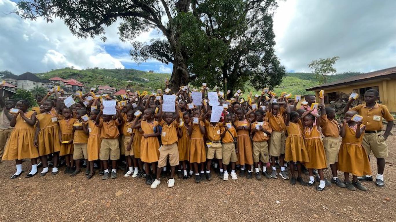 Kids with SolarBuddy lamps at REC primary School, Sierra Leone - July 2026