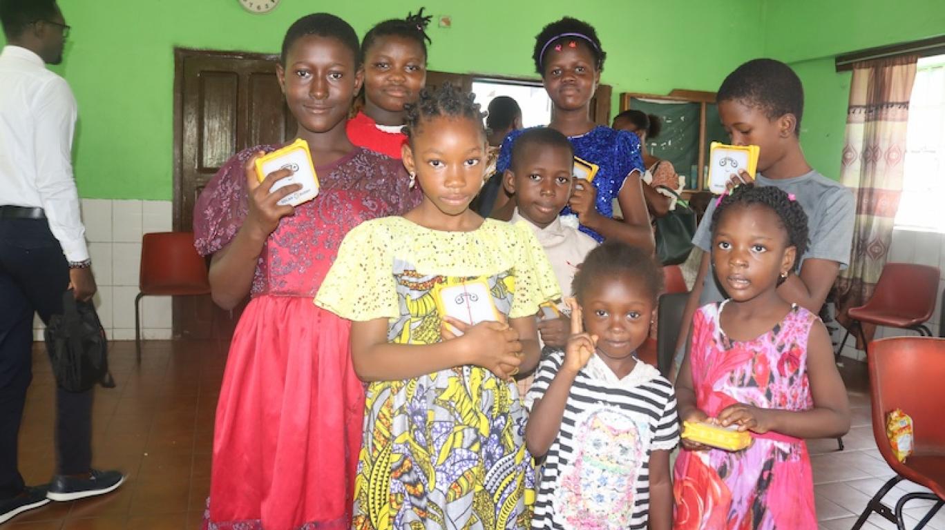Kids with SolarBuddy lamp - Sierra Leone July, 2026