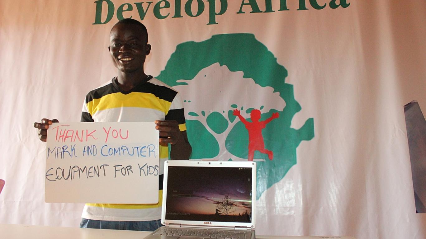 Youth with donated laptop