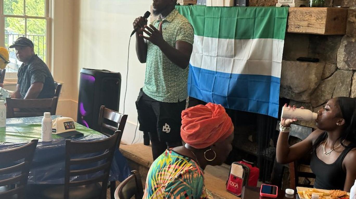 Mo Sanu giving speech at the Swing FORE Change 2026