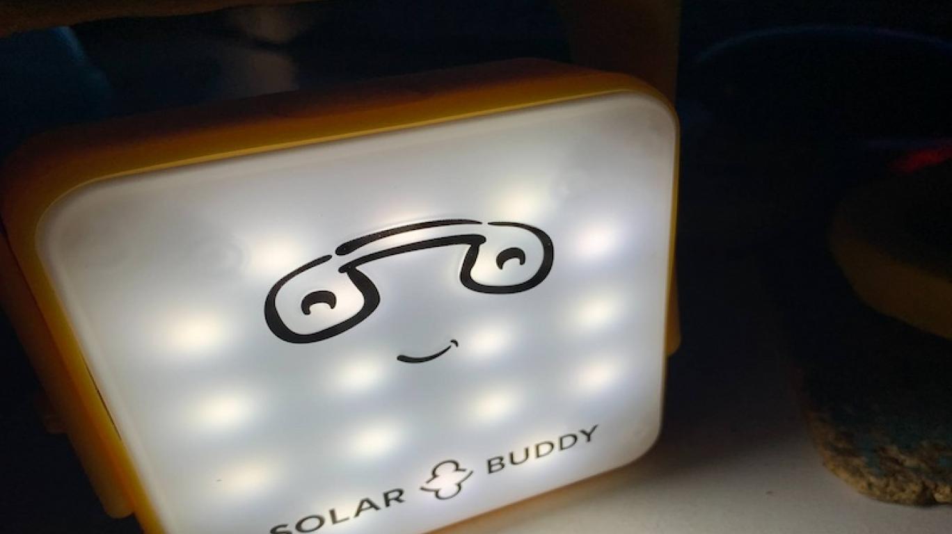 SolarBuddy lamp on a table - Sierra Leone, July 2026