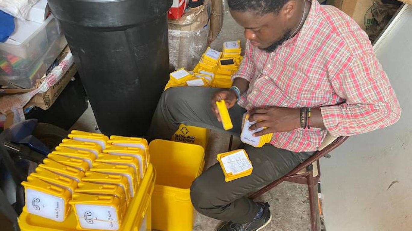 Staff Packing Solar Buddy Lamps - Sierra Leone