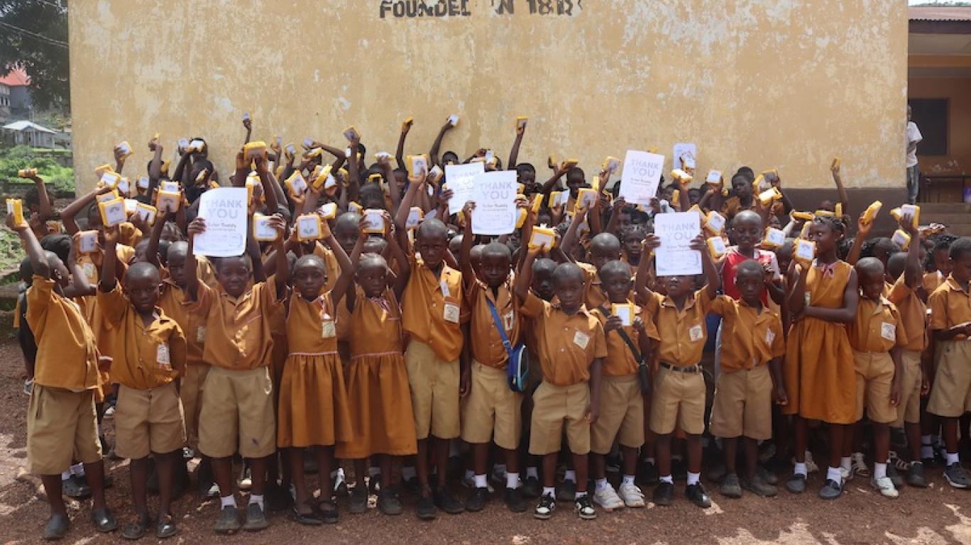 Kids with SolarBuddy lamps at REC primary School, Sierra Leone - July 2026