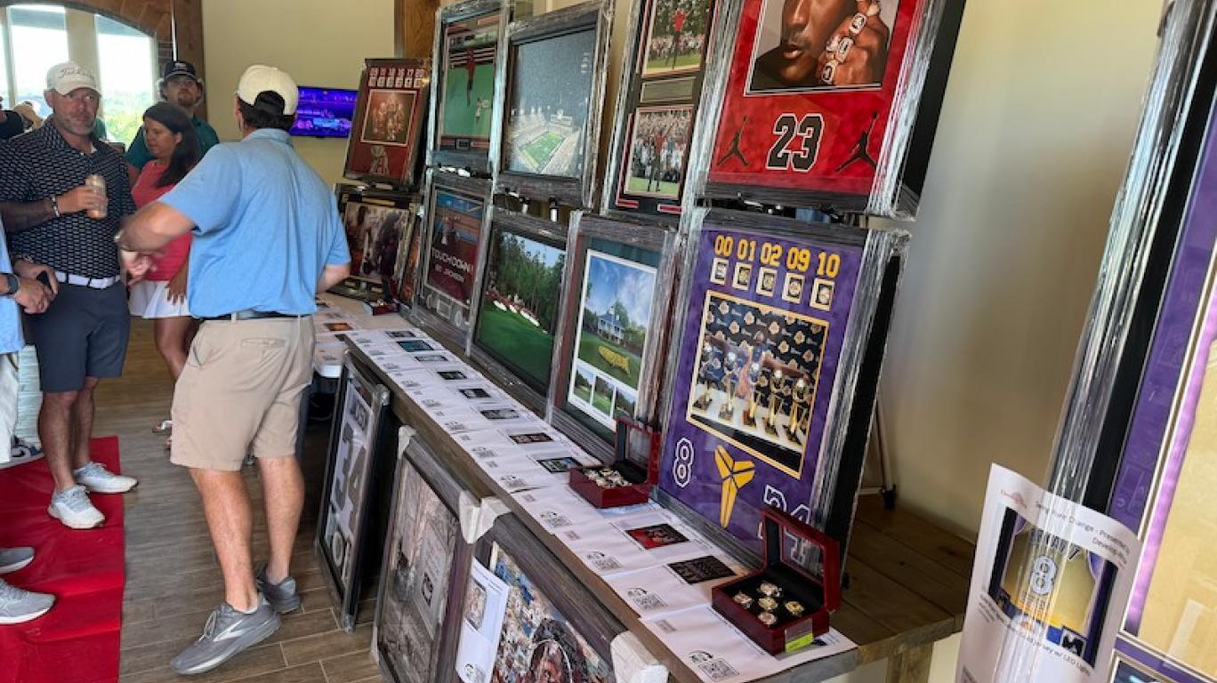 Display of various art at the Swing FORE Change 2026