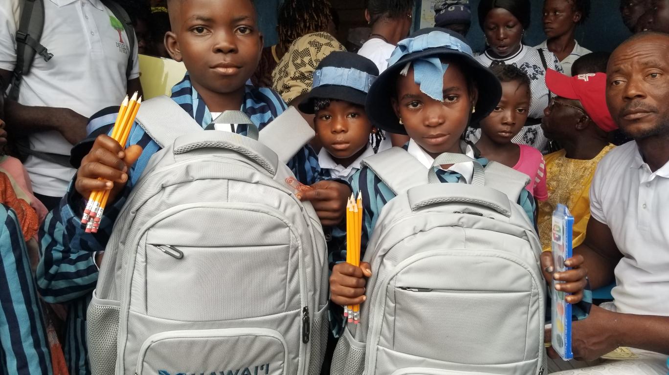 Young Students with bookbags and school supplies