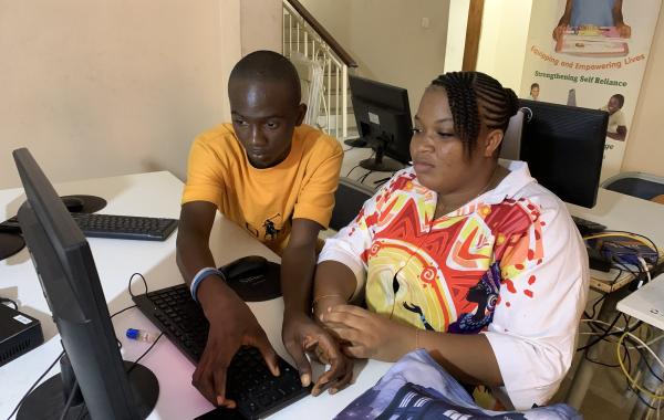 Teacher and student in computer training