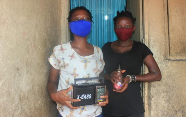 Lucy & Elizabeth with masks and a radio