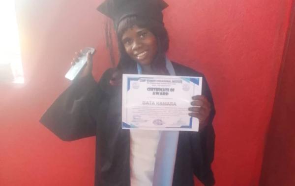 Isata at graduation for Cosmetology