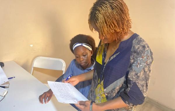 Aminata - Staff, reviewing Marina's letter to her sponsor, Develop Africa, 2026