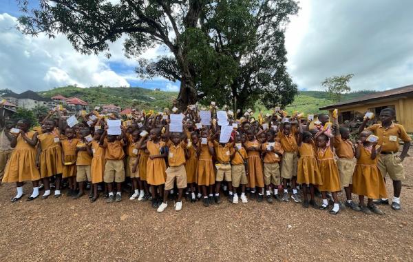 Kids with SolarBuddy lamps at REC primary School, Sierra Leone - July 2026