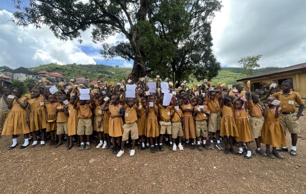 Students at REC Primary School Bathurst, Sierra Leone with SolarBuddy lamp