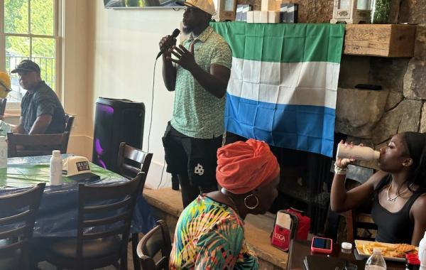 Mo Sanu giving speech at the Swing FORE Change 2026