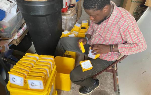 Staff Packing Solar Buddy Lamps - Sierra Leone