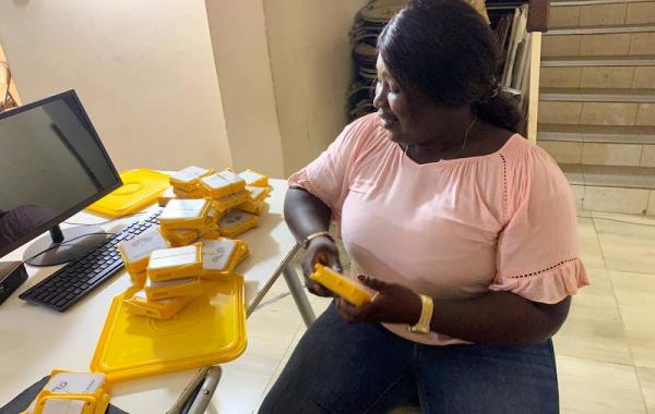 Thomascia, Beneficiary Packing Solar Buddy Lamps - Sierra Leone