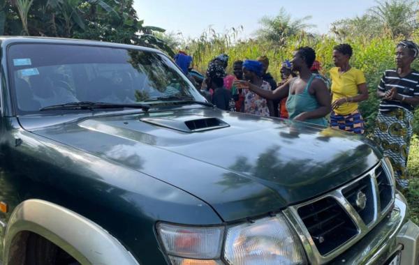 Sylvester being welcomed by the people of Magbaikoli village
