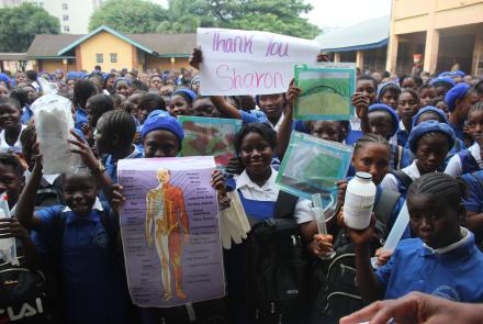 Freetown Secondary School For Girls Hold Sign of Thanks to Sharon