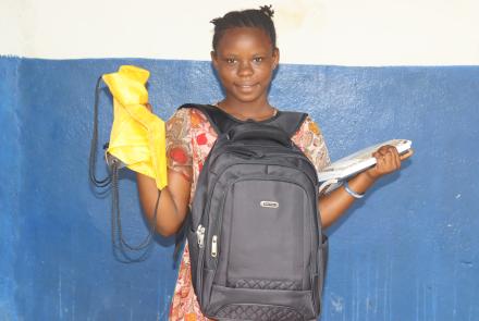 Milicent with her new school supplies