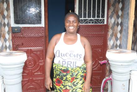 Mariatu outside her business