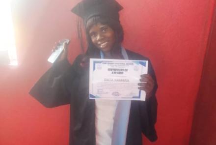 Isata at graduation for Cosmetology