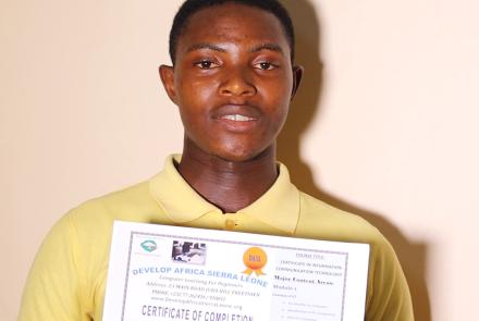 Mohamed with his Computer Class Certificate