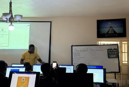 a-man-teaching-a-group-of-students-resume-writing-tips