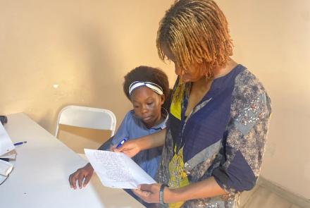 Aminata - Staff, reviewing Marina's letter to her sponsor, Develop Africa, 2026
