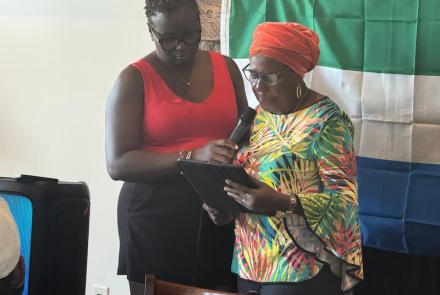 Aminata, Mo Sanu's mother speaking at the Swing FORE Change 2026