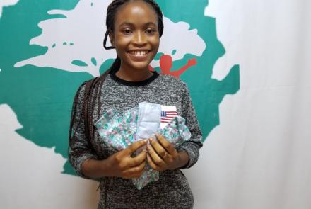 Girl holding reusable sanitary pads