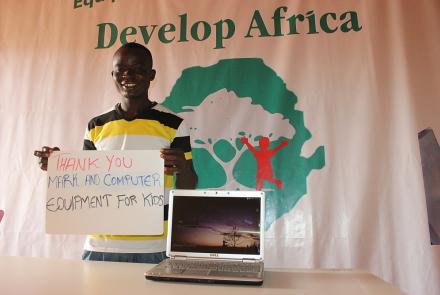 Youth with donated laptop