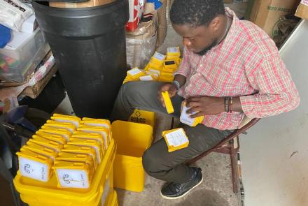 Staff packing SolarBuddy lamps - Sierra Leone