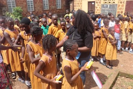 Staff distributing SolarBuddy lamps to kids - Sierra Leone - July 2026