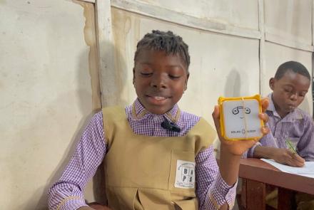 A student with SolarBuddy lamp - Sierra Leone, July 2026