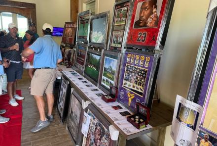 Display of various art at the Swing FORE Change 2026