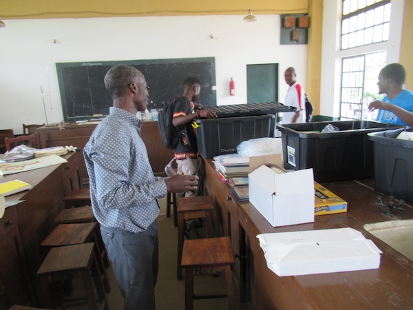 Unpacking science kits at the Prince Wales Secondary School